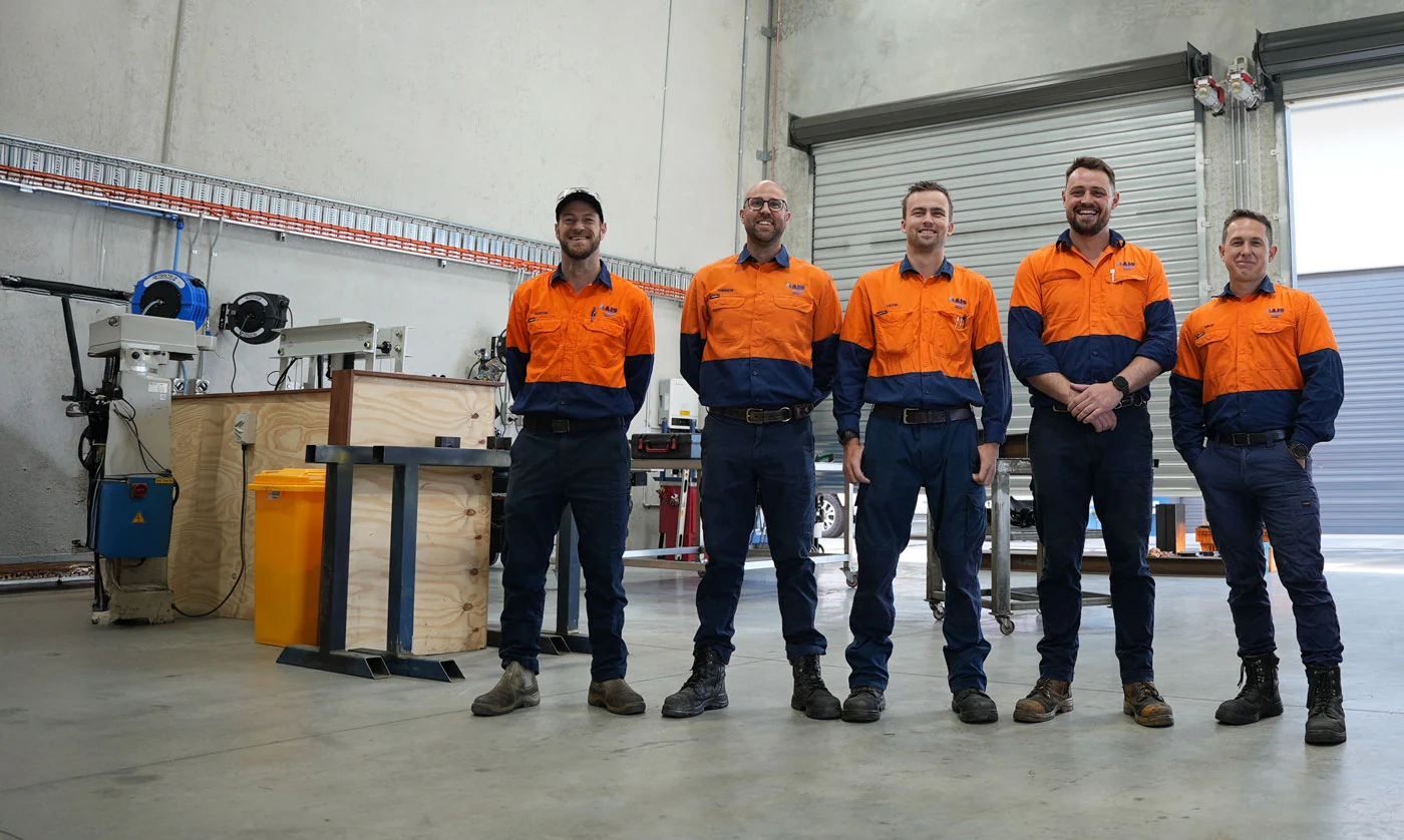Five AIS team members together in the Narangba workshop
